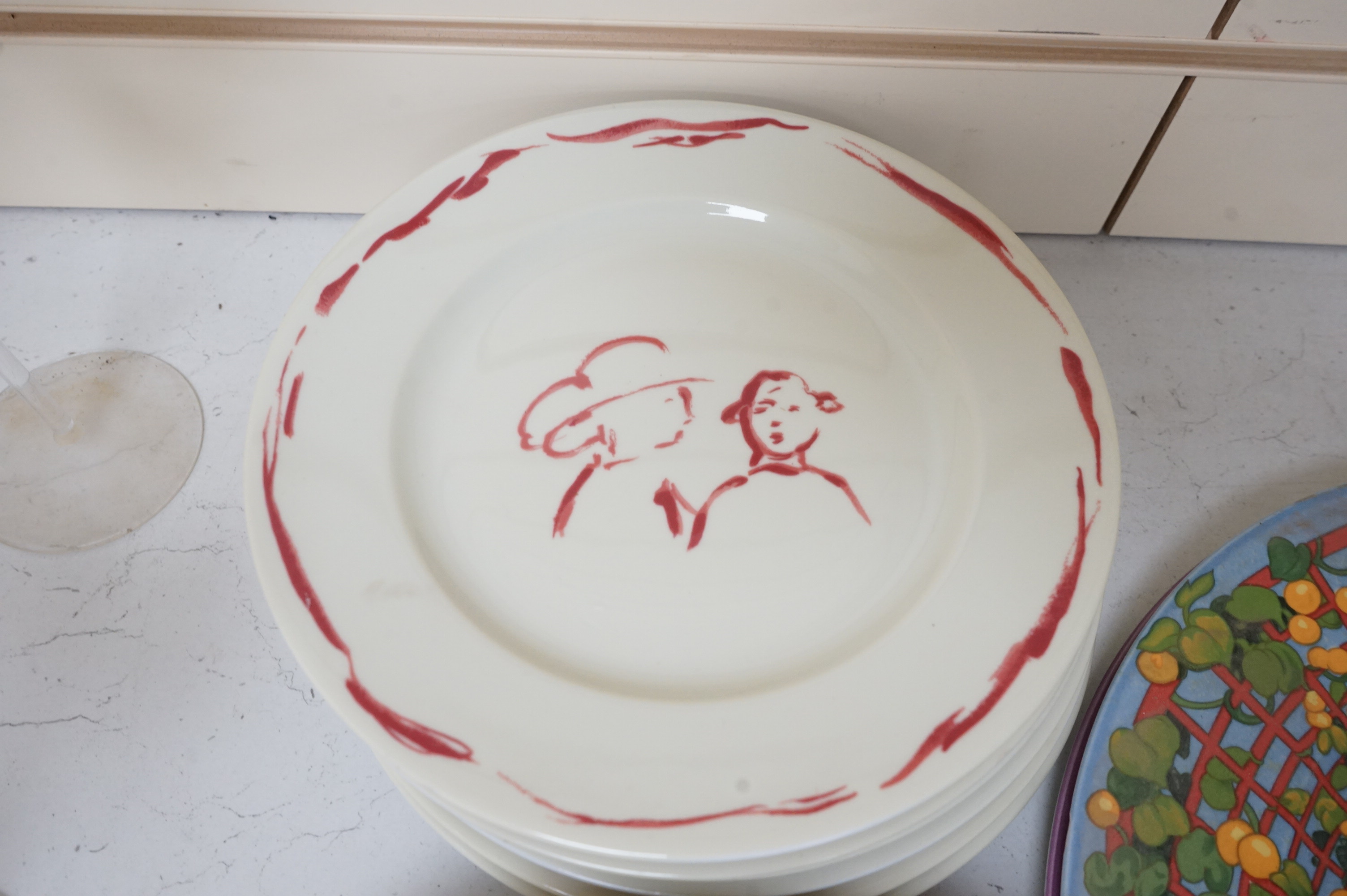 A Pierre Frey ‘Gonesse’ Limoges part dinner service, two Villeroy and Boch ‘Jardins Francais’ dinner plates, with a collection of Riedel wine glasses and mixed Salviati champagne glasses. Villeroy and Boch plates 30.5cm